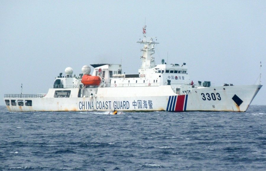 In this photo taken on 25 December 2022, a Chinese coast guard ship patrols Scarborough Shoal in the South China Sea. (AFP)