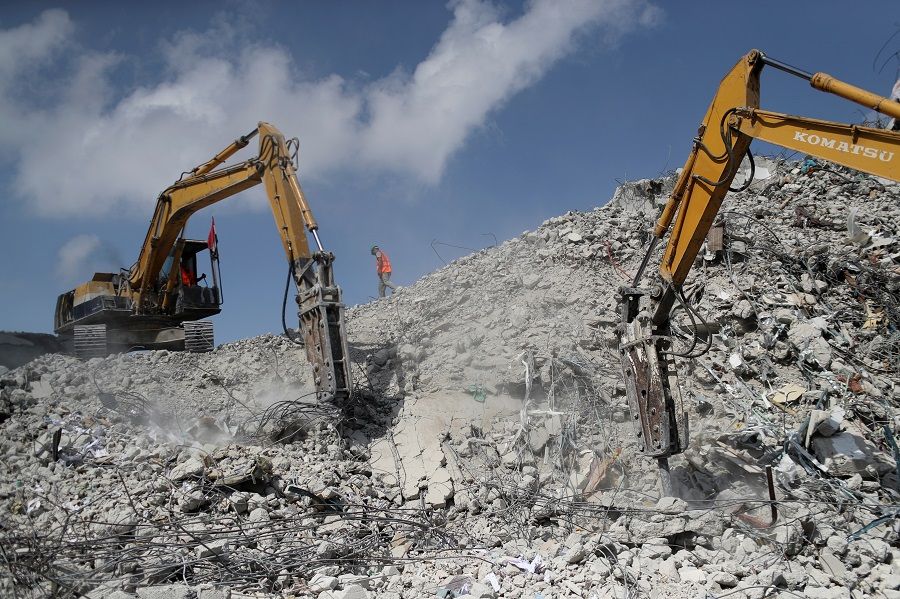 Bulldozers sent by Egypt for Palestinians work at the side of Israeli airstrikes in Gaza, 14 June 2021. (Mohammed Salem/Reuters)