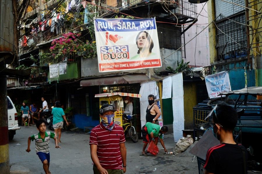 A banner showing support for Sara Duterte, the mayor of Davao City, to run for president is seen in a community in Manila, Philippines, 9 April 2021. (Lisa Marie David/Reuters)