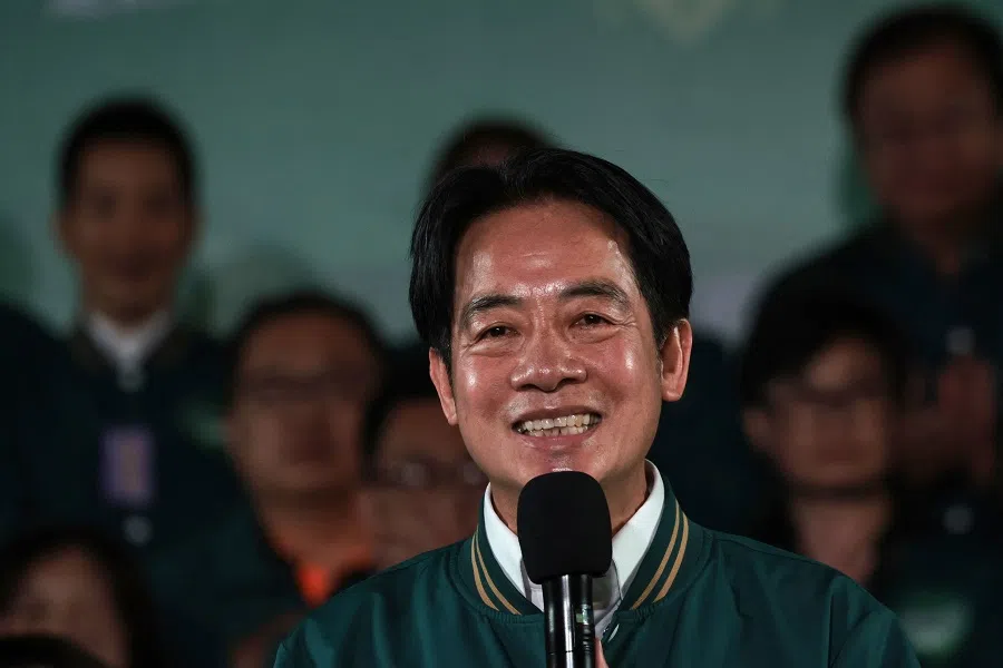 Taiwan's President-elect Lai Ching-te smiles as he attends a rally outside the headquarters of the Democratic Progressive Party (DPP) in Taipei, Taiwan on 13 January 2024, after winning the presidential election. (Yasuyoshi Chiba/AFP)