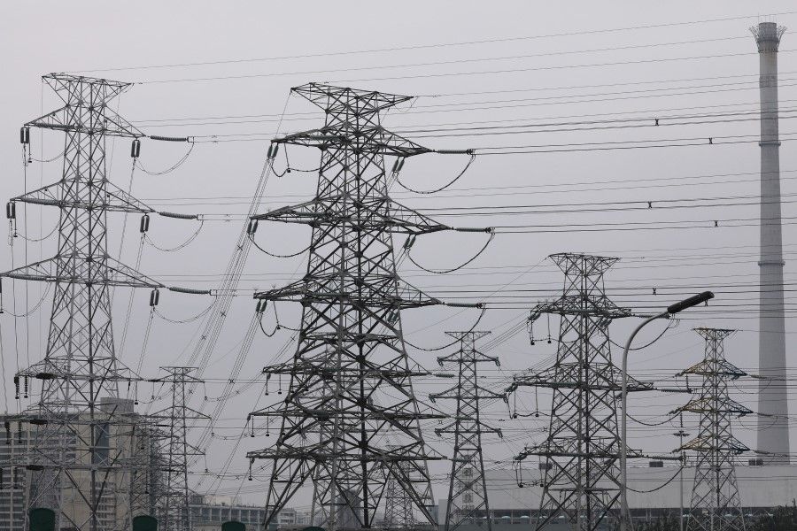 Electricity transmission towers are pictured in Beijing, China, 28 September 2021. (Tingshu Wang/Reuters)