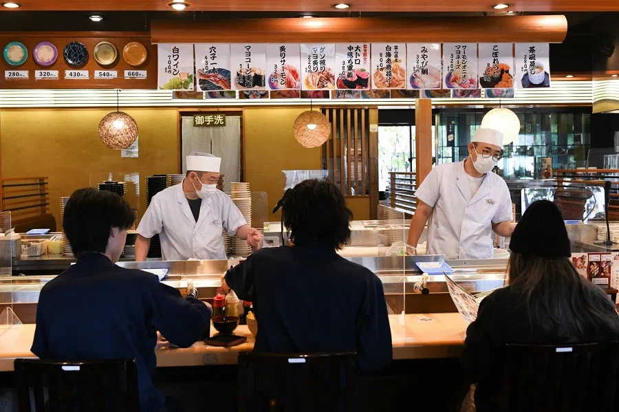 Customers dine at Yoshitsune sushi restaurant in Urayasu, Japan, on 5 December 2022. (Noriko Hayashi/Bloomberg)