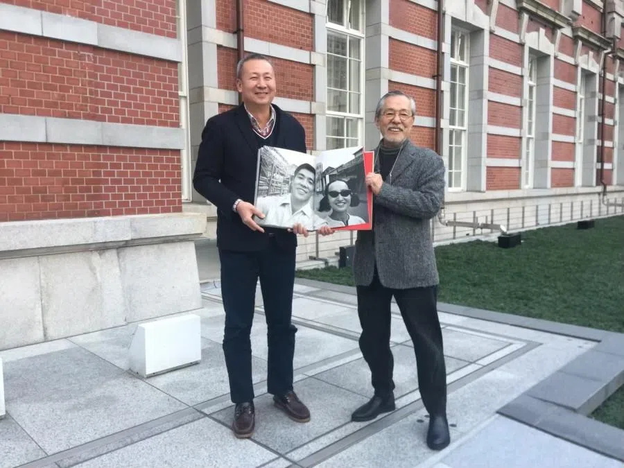 Saito and I holding our collaborative album in front of Tokyo Station Hotel, 2017.