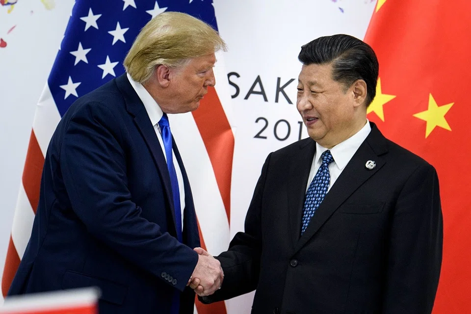 Presidents Donald Trump and Xi Jinping shake hands in a file photo from the G20 Summit in Osaka in June 2019. (Brendan Smialowski/AFP)