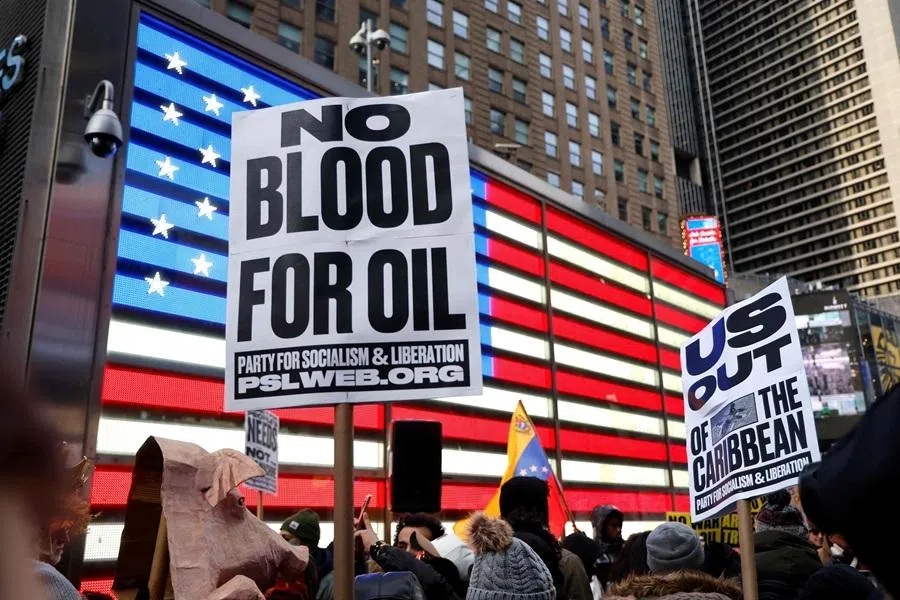 People demonstrate against US military action in Venezuela in Times Square on 3 January 2026 in New York. (John Lamparski/AFP)