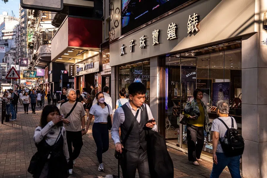 Pedestrians in the Tsim Sha Tsui area of Hong Kong, China, on 16 May 2024. (Lam Yik/Bloomberg)