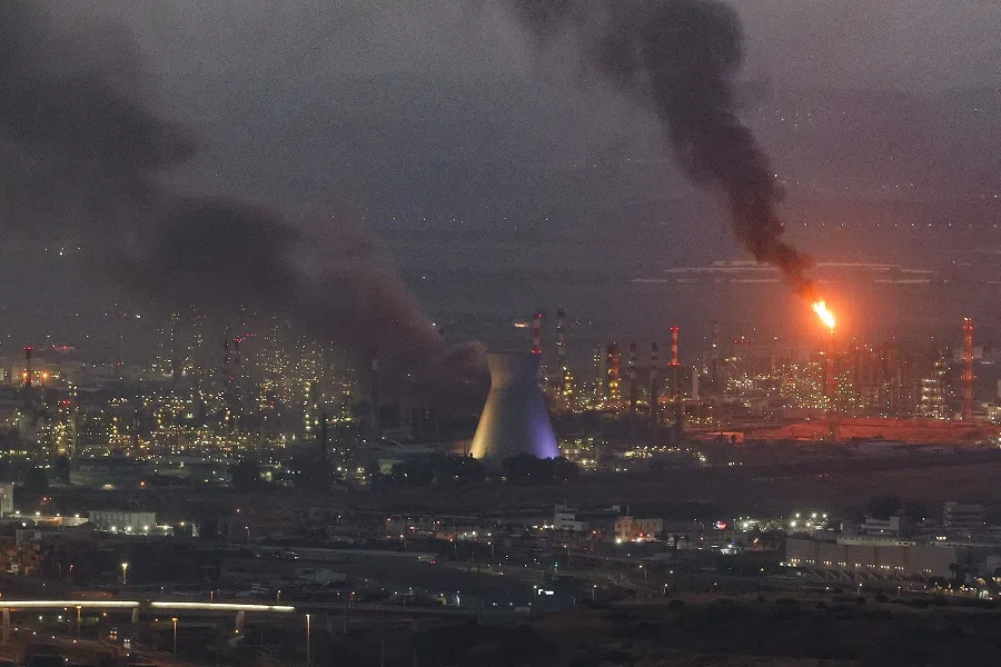 Smoke billows from a site in the city of Haifa, Israel, on 16 June 2025, following a fresh barrage of Iranian missiles. (Ahmad Gharabli/AFP)