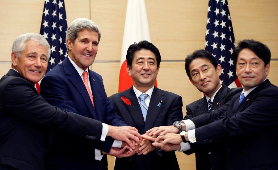 Shinzo Abe (centre) and Fumio Kishida (second from right) with a visiting US delegation, including Chuck Hagel (first from left) and John Kerry (second from left), at the prime minister's official residence in Tokyo, 3 October 2013. (Koji Sasahara via Reuters)