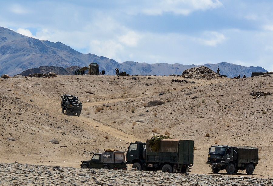 In this file photo taken on 4 July 2020, Indian army soldiers drive vehicles along mountainous roads as they take part in a military exercise at Thiksey in Leh district of the union territory of Ladakh. (Mohd Arhaan Archer/AFP)