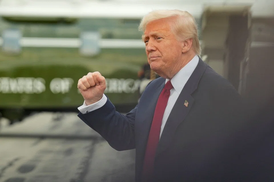 US President Donald Trump gestures as he arrives at Lehigh Valley International Airport in Allentown, Pennsylvania, US, on 1 August 2025. (Ken Cedeno/Reuters)