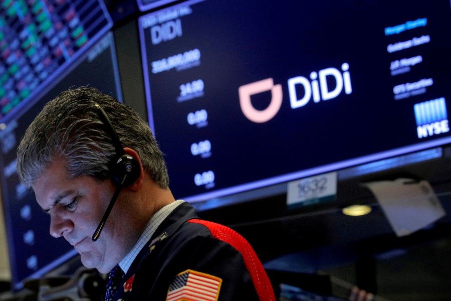 A trader works during the IPO for Chinese ride-hailing company Didi Global Inc on the New York Stock Exchange (NYSE) floor in New York City, US, 30 June 2021. (Brendan McDermid/Reuters)