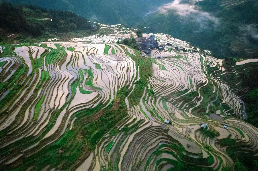 This photo taken on 10 May 2025 shows an aerial view of terraced fields in Congjiang county, Qiandongnan Miao and Dong Autonomous Prefecture, in China’s southwestern Guizhou province. (AFP)