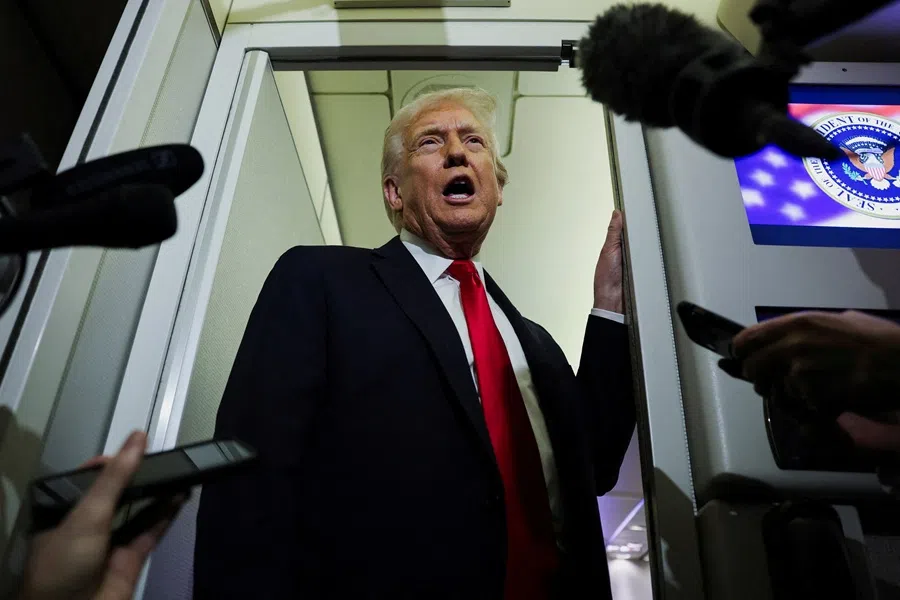 US President Donald Trump speaks to reporters aboard Air Force One during travel to Palm Beach, Florida, from Joint Base Andrews, Maryland, US, on 25 November 2025. (Anna Rose Layden/Reuters)
