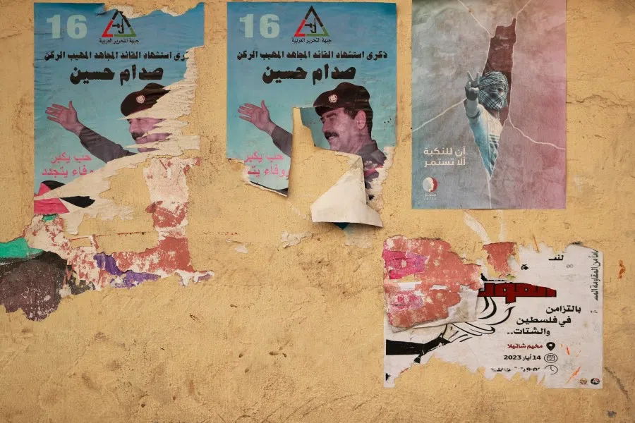 A torn poster depicting late Iraqi dictator Saddam Hussein hangs on a wall in the southern suburb of Beirut, Lebanon, on 7 November 2023. (Ahmad Al-Rubaye/AFP)