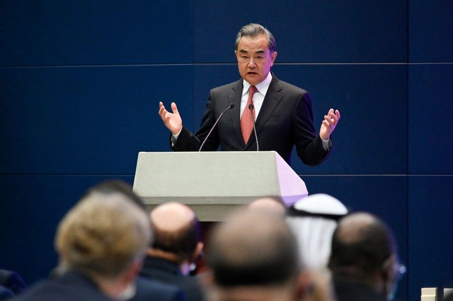 China's Foreign Minister Wang Yi speaks at the Chinese Foreign Ministry in Beijing on 12 April 2021. (Wang Zhao/AFP)