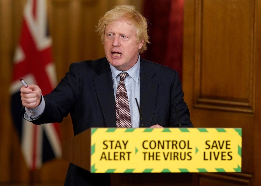 A handout image released by 10 Downing Street, shows Britain's Prime Minister Boris Johnson as he speaks during a remote press conference inside 10 Downing Street, 3 June 2020. (Andrew Parsons/10 Downing Street/AFP)
