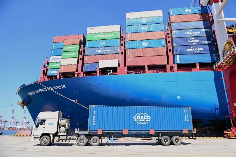 A cargo ship loaded with containers is seen at a port in Qingdao, Shandong province, China, on 7 September 2022. (AFP)