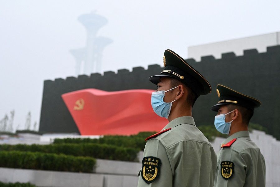 Paramilitary police stand outside the Museum of the Communist Party of China, near the Bird's Nest national stadium in Beijing, China on 25 June 2021. (Noel Celis/AFP)