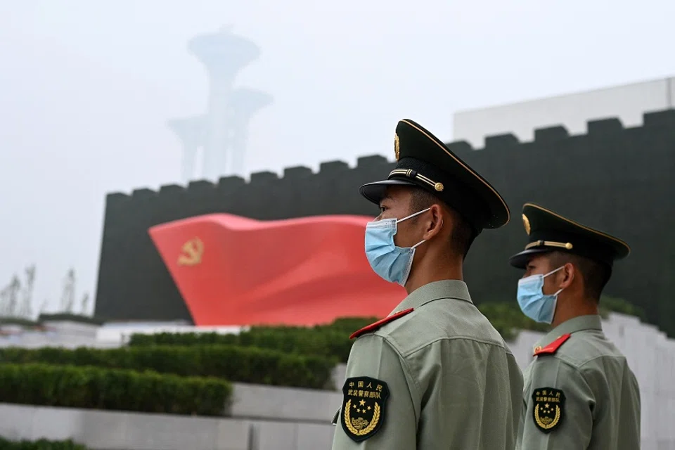 Paramilitary police stand outside the Museum of the Communist Party of China, near the Bird's Nest national stadium in Beijing, China on 25 June 2021. (Noel Celis/AFP)