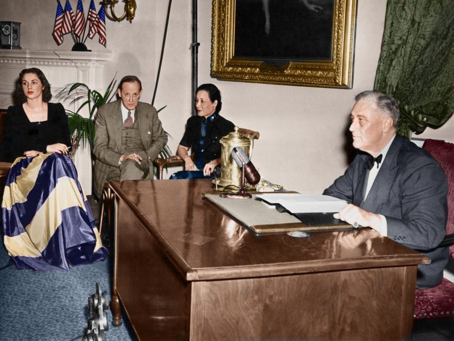 US President Franklin Roosevelt speaks to the nation commemorating the 210th birth anniversary of the first president of the US, George Washington, 22 February 1943. From left: Mara di Zoppola (a relative of President Roosevelt), Harry Hopkins (Roosevelt's close friend and confidante, who arranged for Madame Chiang's visit to the US), and Madame Chiang.