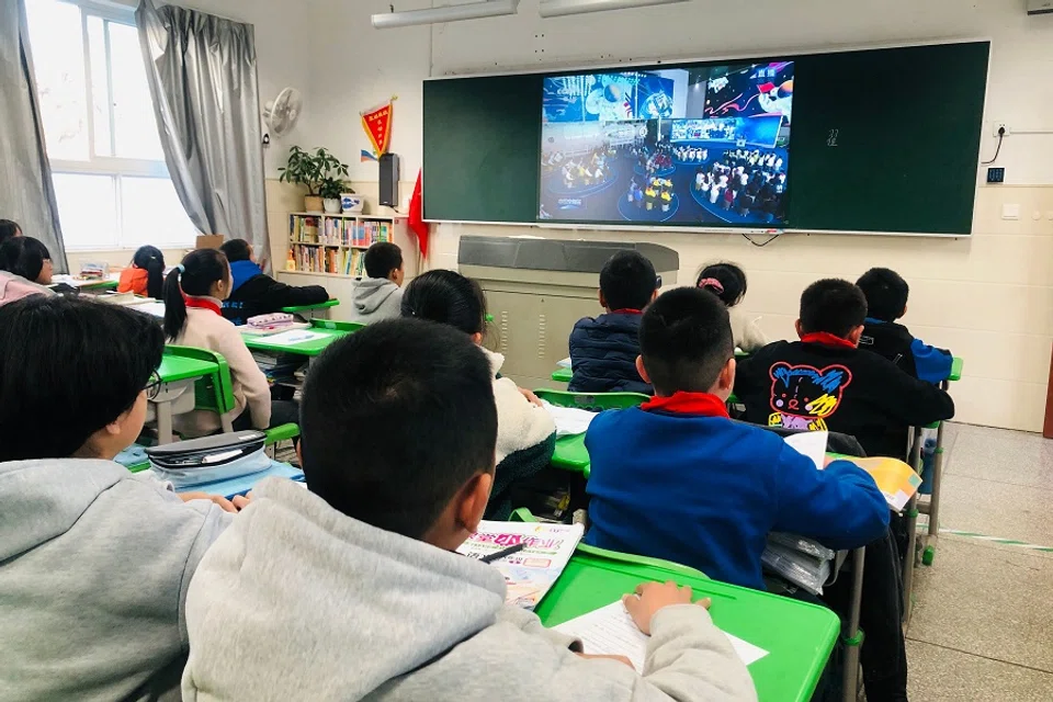 Students attend a lesson at a school in Qingyuan county, Lishui city, Zhejiang province, China, on 9 December 2021. (AFP)