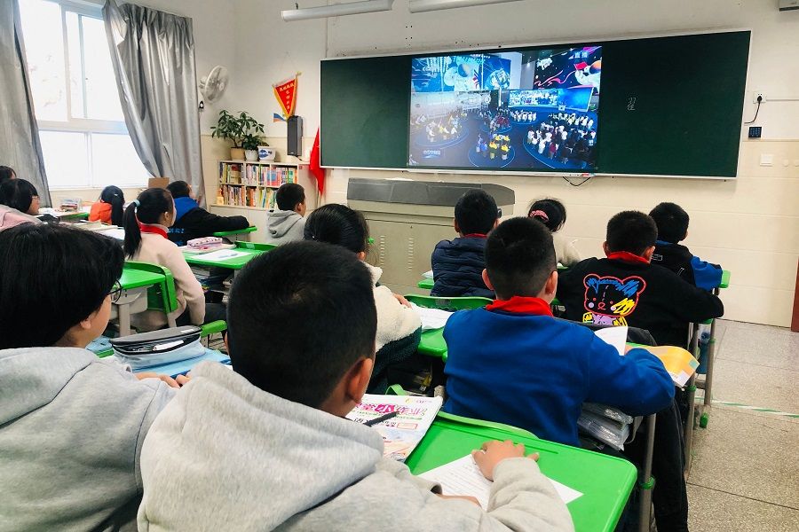 Students attend a lesson at a school in Qingyuan county, Lishui city, Zhejiang province, China, on 9 December 2021. (AFP)