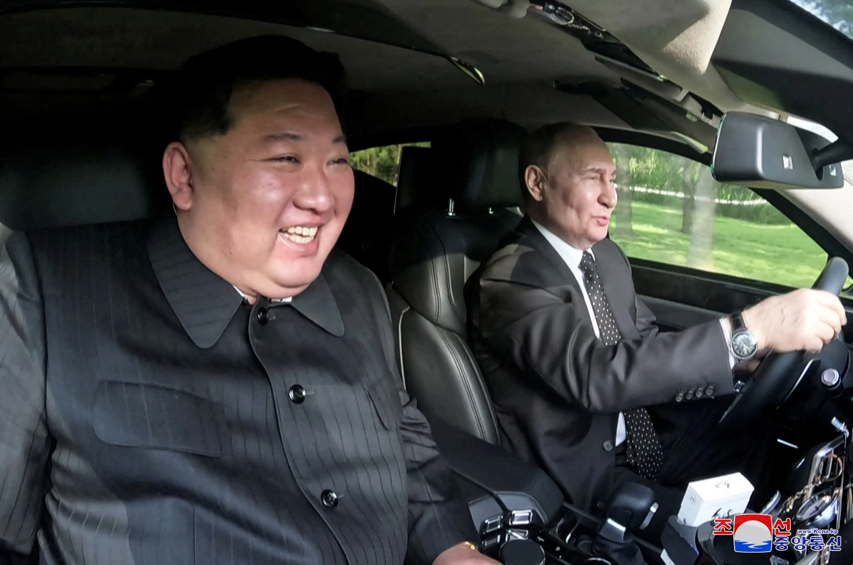 Russia’s President Vladimir Putin and North Korea’s leader Kim Jong Un ride an Aurus car in Pyongyang, North Korea in this image released by the Korean Central News Agency, 20 June 2024. (KCNA via Reuters)