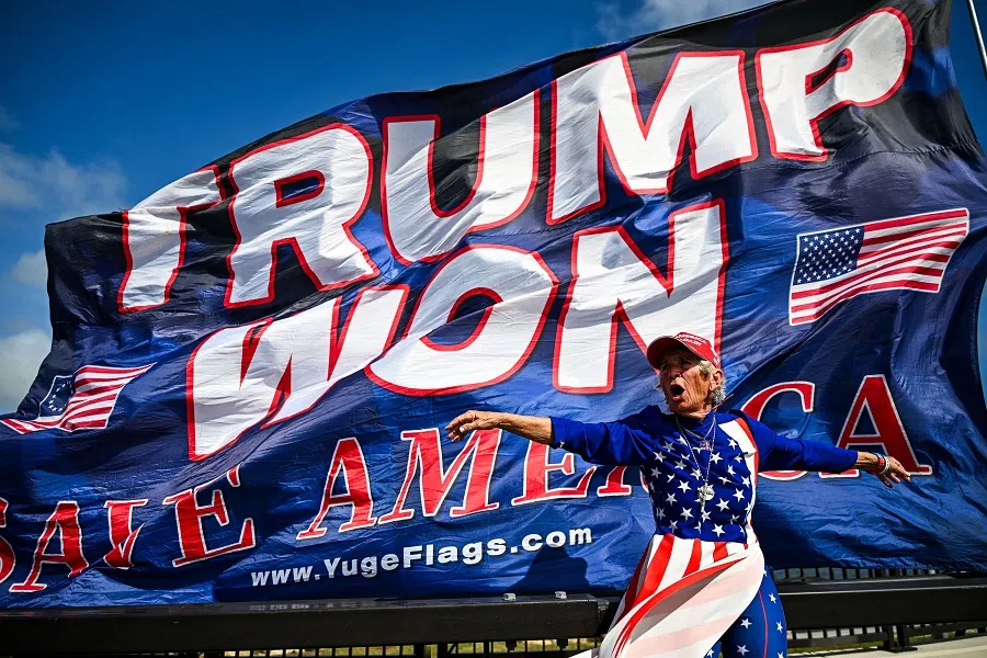Supporters of former US President and Republican presidential candidate Donald Trump celebrate his victory near his Mar-a-Lago resort in Palm Beach, Florida, US, on 6 November 2024. (Chandan Khanna/AFP)
