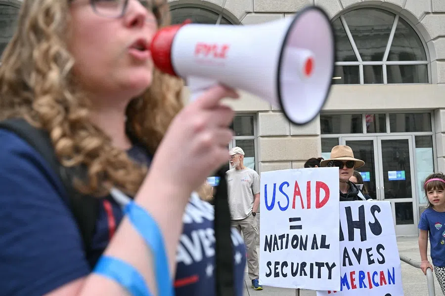 Demonstrators gather outside USAID offices for the nationwide “Hands Off!” protest against US President Donald Trump and his adviser, Tesla CEO Elon Musk, in Washington, DC, US, on 5 April 2025. (Roberto Schmidt/AFP)
