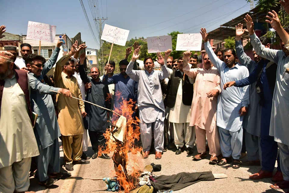Demonstrators shout slogans and burn an effigy of India’s Prime Minister Narendra Modi during an anti-India protest in Muzaffarabad, the capital of Pakistan-administered Kashmir, on 29 April 2025. (Sajjad Qayyum/AFP)