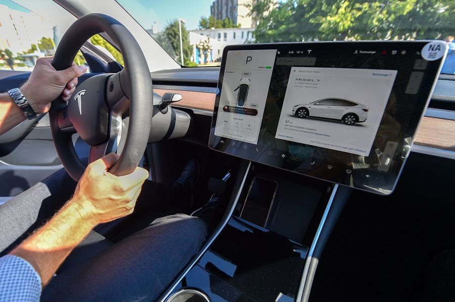 A picture taken on 5 September 2020 shows an inside view of a "Tesla Model Y" car, an all-electric compact SUV by US electric car giant Tesla, during its presentation at the Automobile Club in Budapest. (Attila Kisbenedek/AFP)