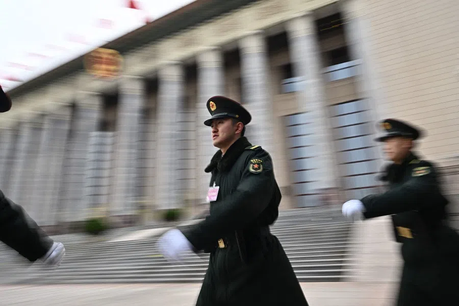 Chinese People’s Liberation Army (PLA) soldiers patrol at the Great Hall of the People in Beijing on 3 March 2025, ahead of the country’s annual legislative meetings known as the “Two Sessions”. (Pedro Pardo/AFP)