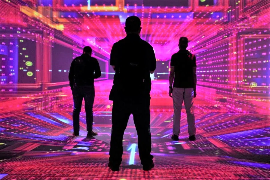 People watch a lights performance at TelcoDR Cloud City during the Mobile World Congress (MWC) in Barcelona, Spain, 29 June 2021. (Albert Gea/Reuters)
