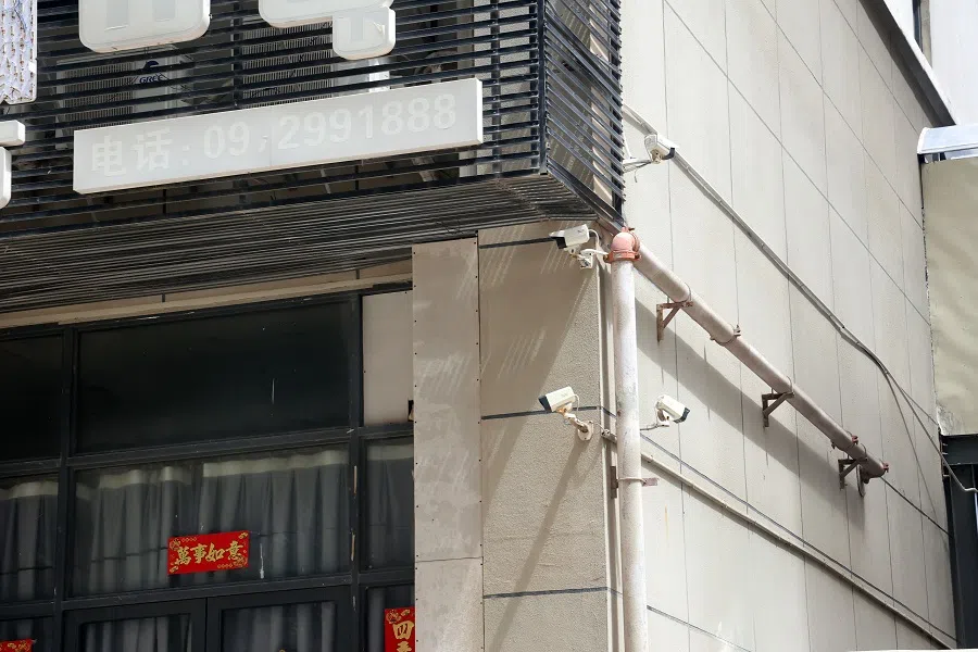 Surveillance cameras are everywhere in these compounds.