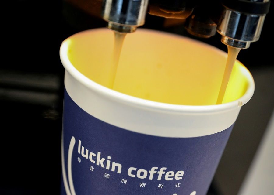 A cup of coffee is poured during Luckin Coffee's IPO at the Nasdaq MarketSite in New York, US, 17 May 2019. (Brendan McDermid/File Photo/Reuters)