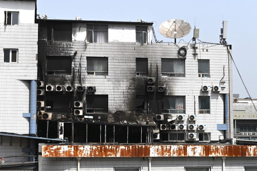 Fire damage is seen at the Changfeng Hospital in Beijing on 19 April 2023, after a fire broke out a day earlier. (Greg Baker/AFP)