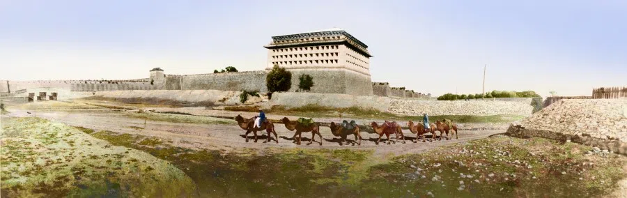 A camel caravan passes through Beijing's city gates, 1900s. The camels are all double-humped, and the merchants are wearing robes and capes to shield against the desert sand and sun. Double-humped camels are found in Mongolia, Central Asia and Turkey, while single-humped camels are found in Africa. As they are tough enough to withstand drought and cold, camels were long favoured by merchants as the main mode of transportation to and from China.