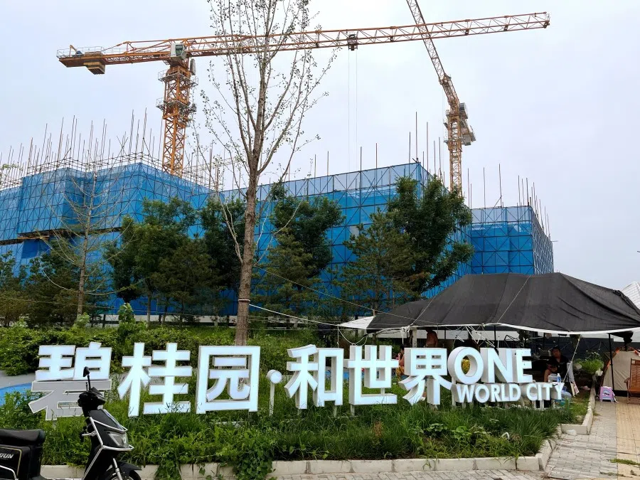 Residential buildings by Chinese developer Country Garden are under construction in Beijing, China, 11 August 2023. (Tingshu Wang/Reuters)