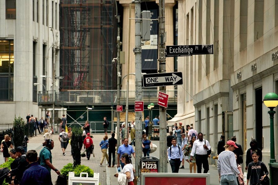 Pedestrians near the New York Stock Exchange in New York, US, on 28 August 2023. (Gabby Jones/Bloomberg)