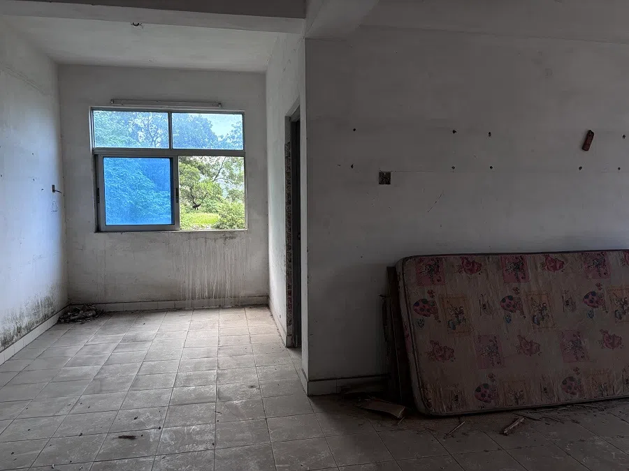 An abandoned unit lies barren.