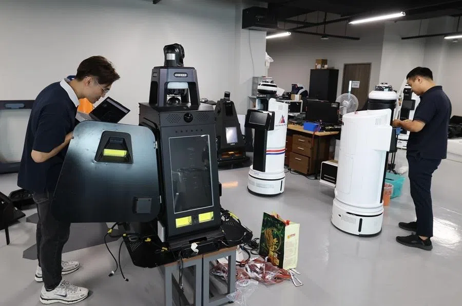 Employees work at PATEC Group in Singapore.