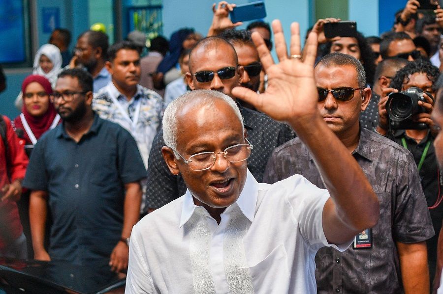 Ibrahim Mohamed Solih (centre), the incumbent Maldives president, waves after casting his ballot at a polling station in Male, Maldives, on 30 September 2023. (Mohamed Afrah/AFP)