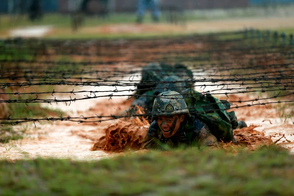 Soldiers of the People's Liberation Army (PLA) Marine Corps are seen in training in Zhanjiang, Guangdong province, China, 20 July 2017. (Stringer/File Photo/Reuters)