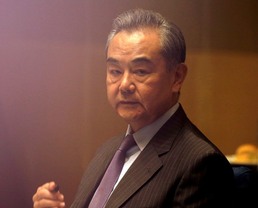 China's Foreign Minister Wang Yi listens during a meeting in Manila, Philippines, 16 January 2021. (Francis Malasig/Pool via Reuters)