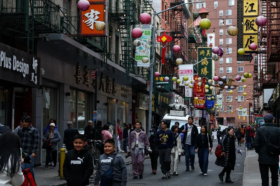 People walk through Chinatown in New York City, US, 14 April 2025. (Kylie Cooper/Reuters)