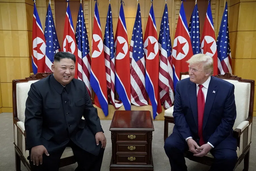 US President Donald Trump meets with North Korean leader Kim Jong Un at the demilitarized zone separating the two Koreas, in Panmunjom, South Korea, 30 June 2019.