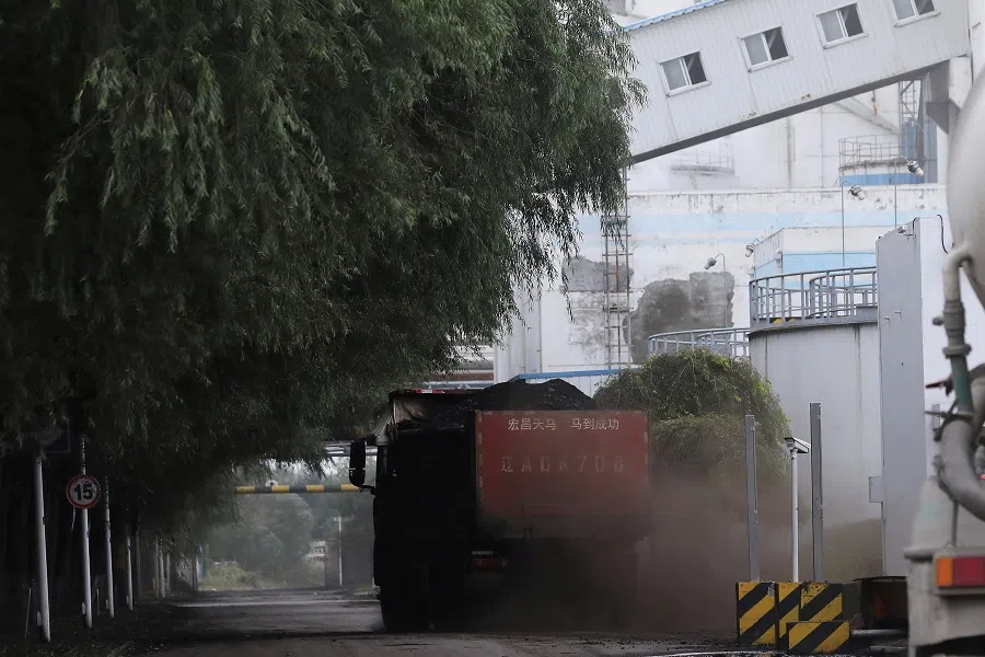 A truck transports coal at a coal-fired power plant in Shenyang, Liaoning province, China, 29 September 2021. (Tingshu Wang/File Photo/Reuters)