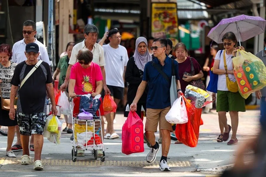 People walk in the Chong Pang neighbourhood of Singapore.
