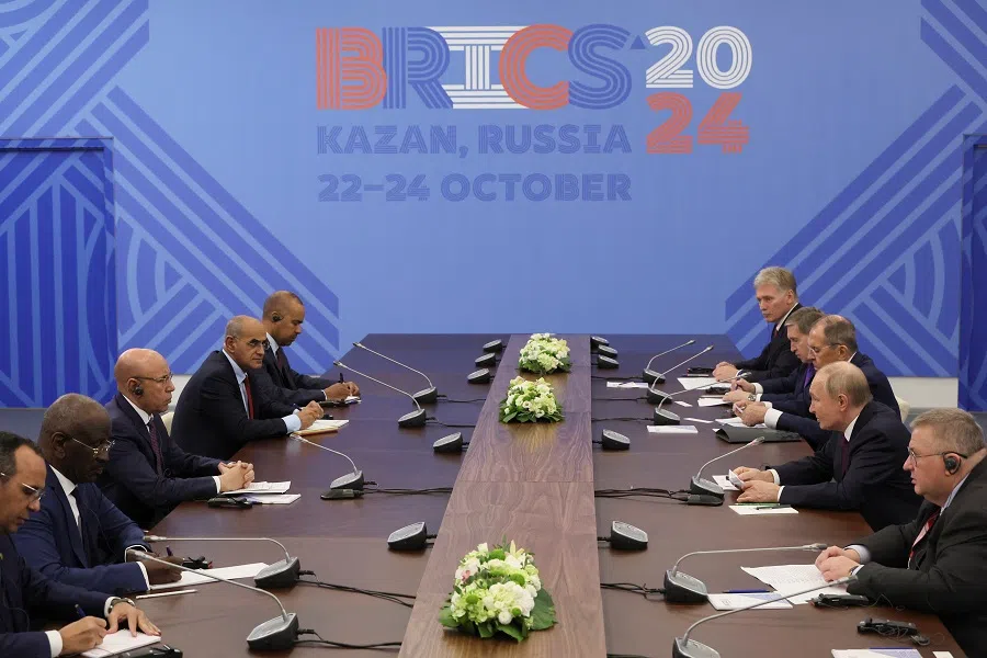 Delegations, led by Russia’s President Vladimir Putin and Mauritania’s President Mohamed Ould Ghazouani, hold talks on the sidelines of the BRICS summit in Kazan, Russia on 24 October 2024. (Maxim Shipenkov/Pool via Reuters)