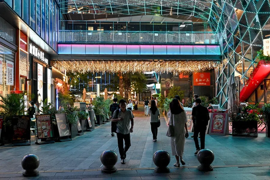 People visit a shopping centre in Shenzhen, China’s southern Guangdong province on 17 July 2025. (Adek Berry/AFP)
